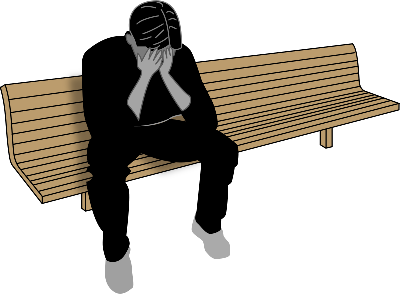 Sad Man Sitting on a Park Bench