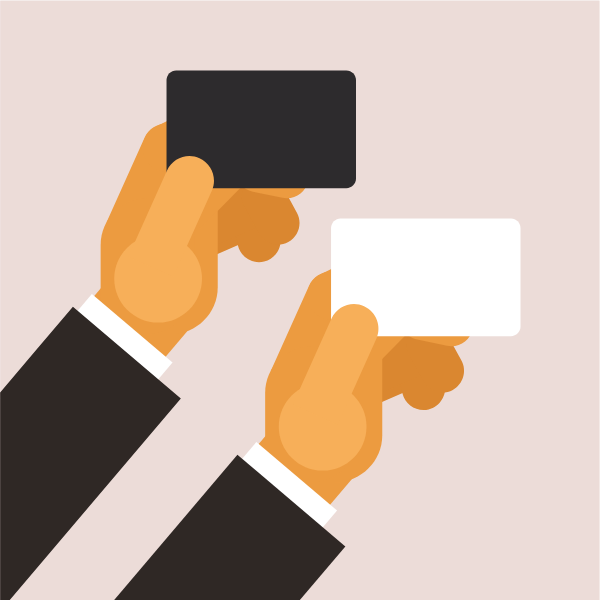 Hand holding a business card