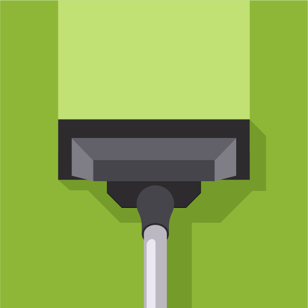 Vacuum cleaner on the green carpet