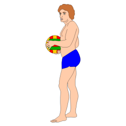 A man stands on the beach, holding a ball in his hand