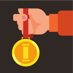 Hand is holding a gold medal