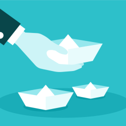 Hand Holding Paper Boat