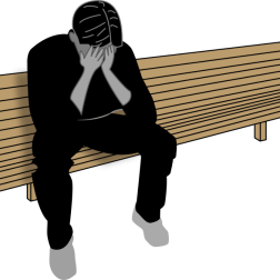 Sad Man Sitting on a Park Bench